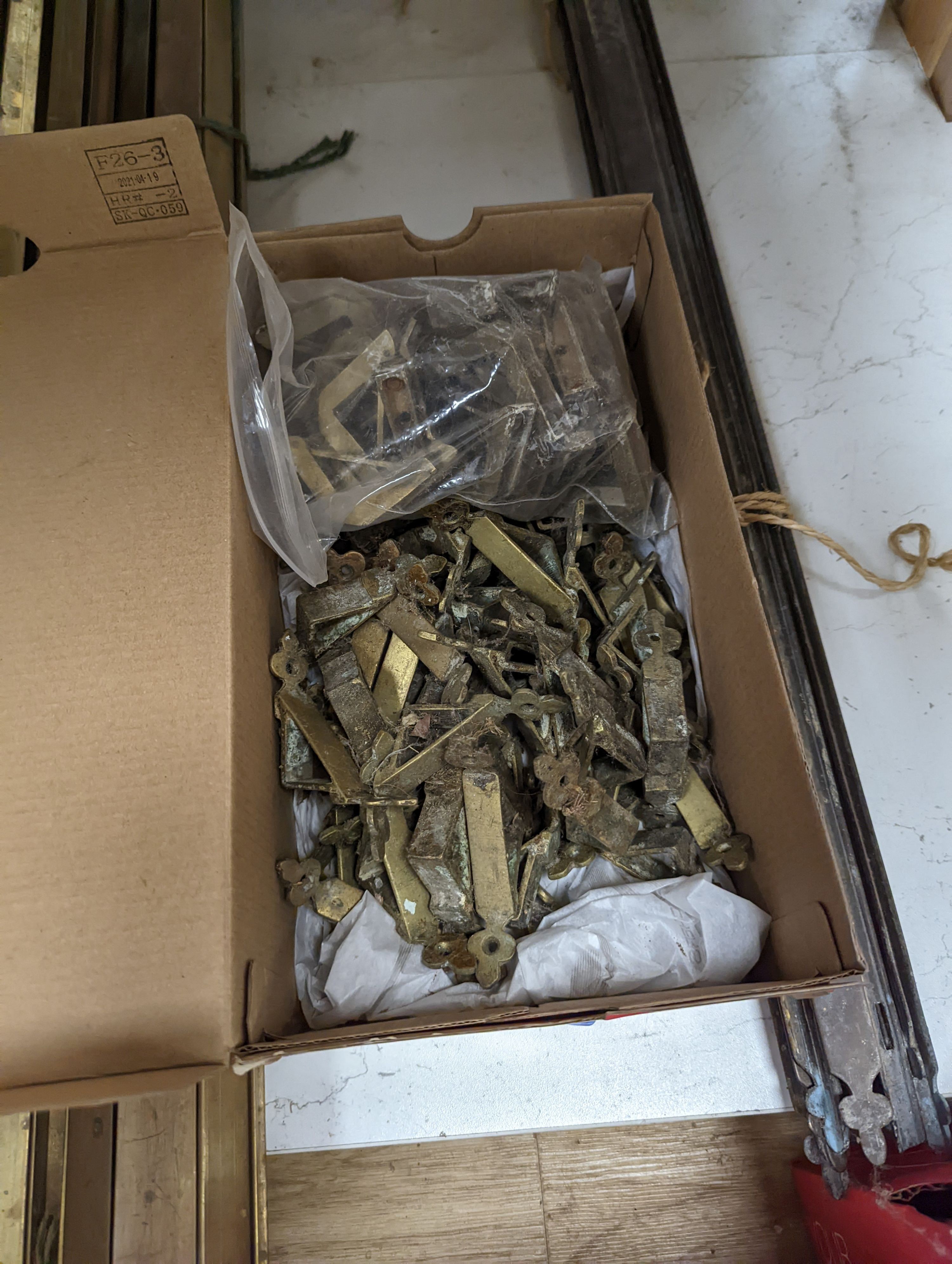 Two sets of brass stair rods with fittings.